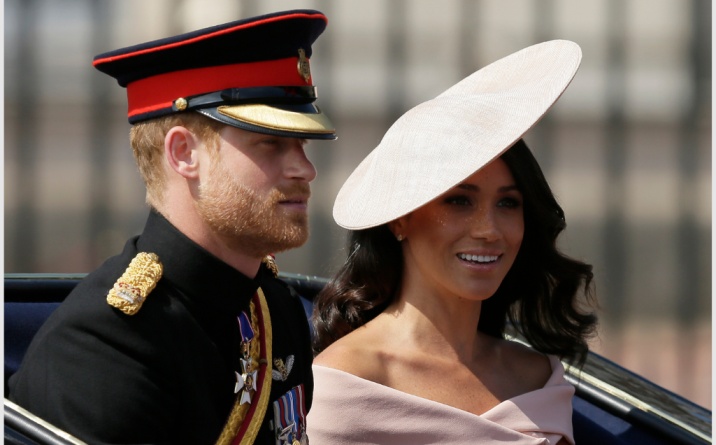 Prince Harry and wife Meghan Markle leave the UK's Royal Palace