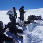 Siachen: Siachen: Army personnel recover the body of a porter who died after slipping into a 200-feet-deep crevasse in Siachen of Jammu and Kashmir 2, 2016. (Photo: IANS/DPRO)