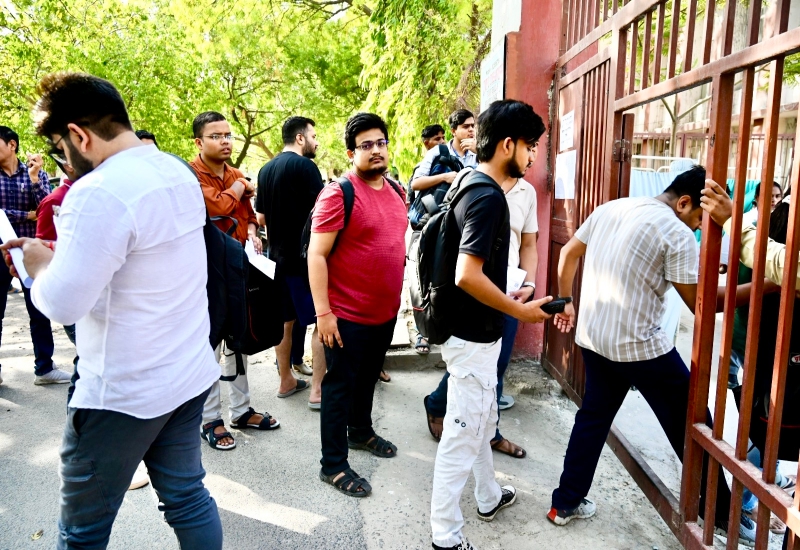 Noida: Candidates stand in queues to appear for the Union Public Service Commission (UPSC) exam at an examination center, in Noida , Sunday, June 16, 2024.(IANS/Ramesh Sharma)