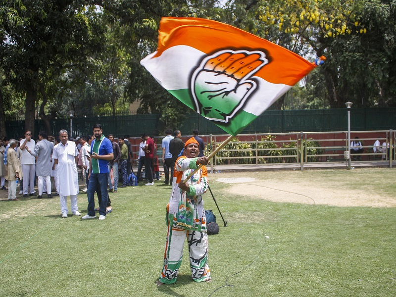 New Delhi : Congress supporters and workers celebrate the party's lead during the counting of votes for the Lok Sabha elections at AICC headquarters