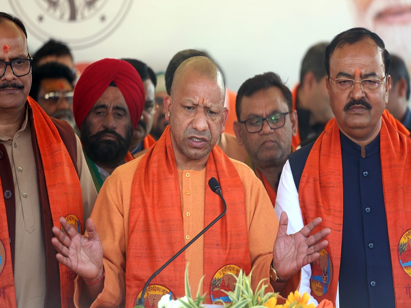 Prayagraj: Uttar Pradesh Chief Minister Yogi Adityanath addresses after the Council of Ministers in the Triveni Complex at Triveni Sangam on the tenth day of the 45-day-long Maha Kumbh Mela 2025 in Prayagraj on Wednesday, January 22, 2025. Deputy CM Keshav Prasad Maurya and Brajesh Pathak also present. (Photo: IANS)