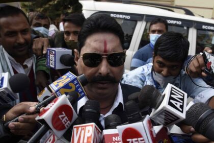 Patna: Jailed RJD MLA Anant Kumar Singh talks to the media outside the Bihar Assembly during the ongoing winter session, in Patna on Nov 25, 2020. (Photo: IANS)