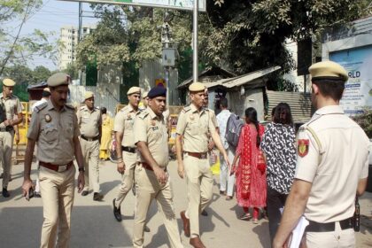 New Delhi: Delhi Police personnel patrol Sarojini Nagar market amid huge crowds shopping on the occasion of the Dhanteras festival in New Delhi on Tuesday, October 29, 2024. (Photo: IANS/Qamar Sibtain)