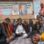 Patna: Jan Suraaj chief Prashant Kishor with others during an indefinite hunger strike demanding the cancellation of the 70th Integrated Combined Competitive (Preliminary) Examination (CCE), 2024, conducted by the BPSC, over allegations of a question paper leak near the Mahatma Gandhi statue in Patna on Sunday, January 05, 2025. (Photo: IANS)